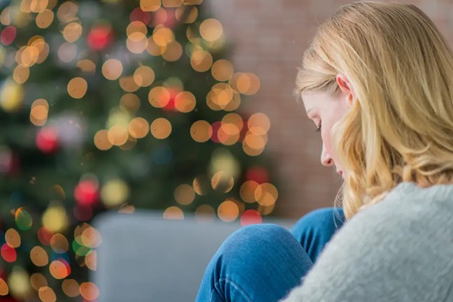 Woman dealing with loneliness during the holiday season