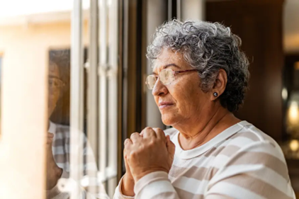 Elderly woman in deep thought