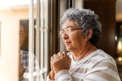 Elderly women in deep thought due to intolerant behavior in Dallas, Texas