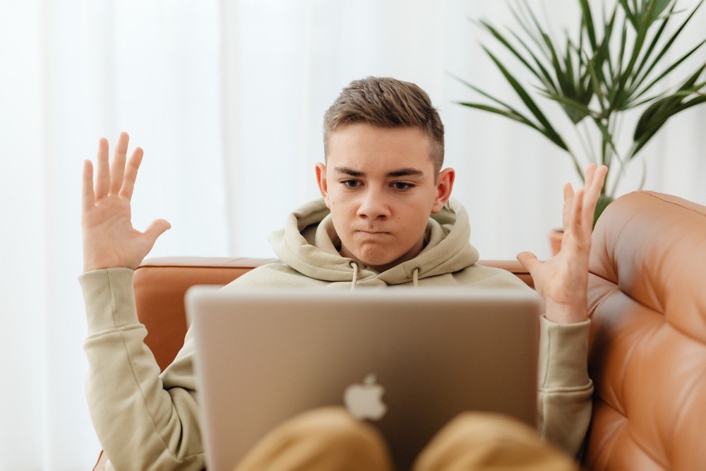frustrated young man with laptop