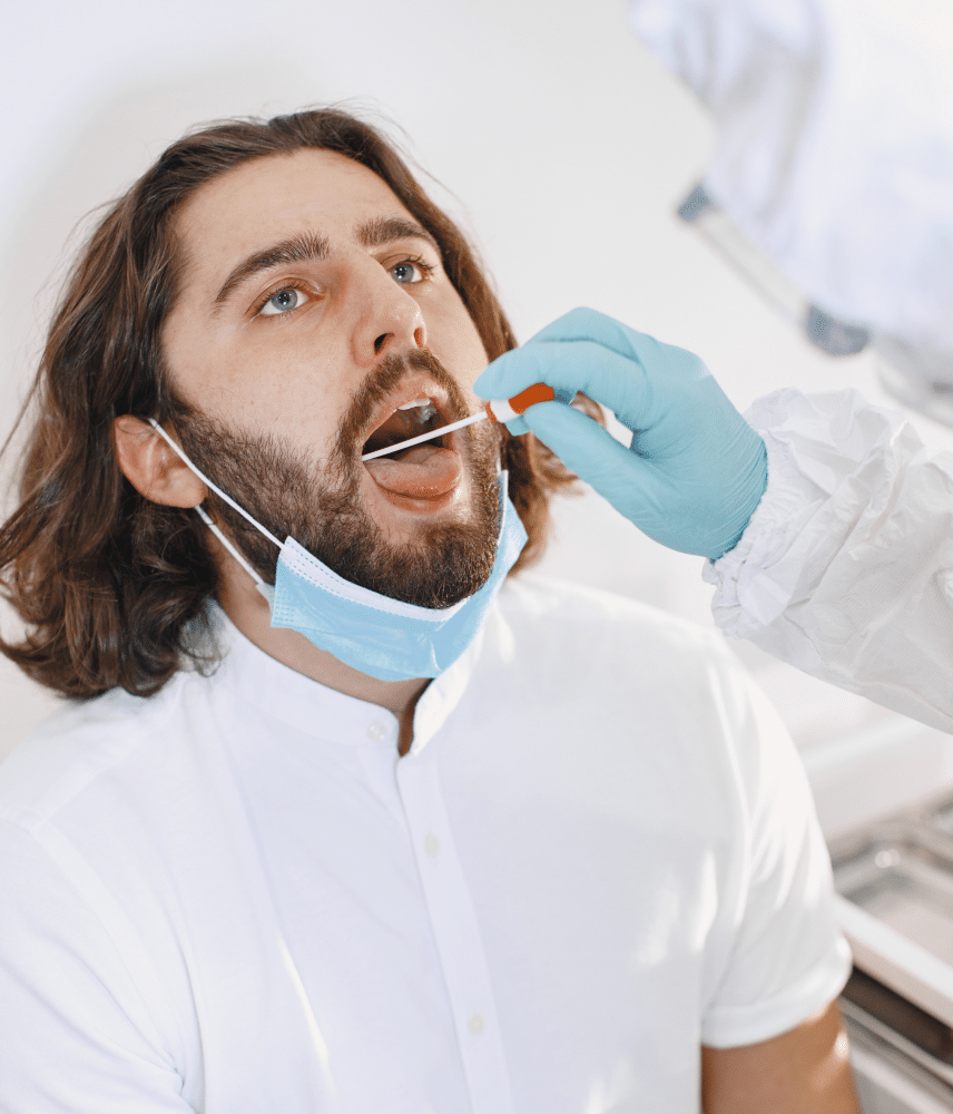 man getting cheek swab test
